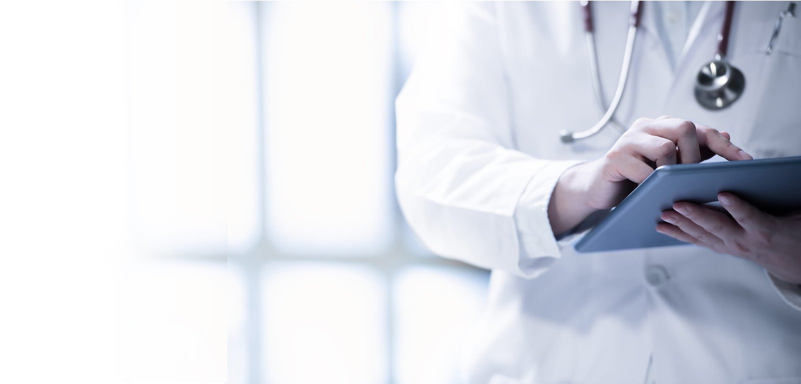 Doctor using a tablet with hospital management software